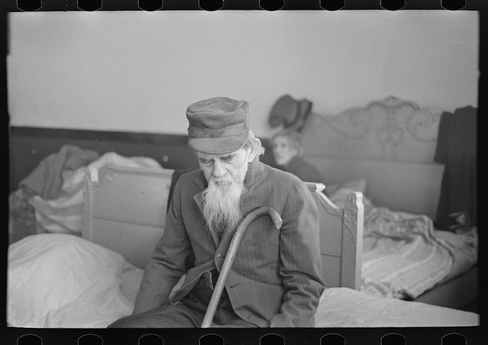 A blind and paralyzed man refugee from the flood in the schoolhouse at Sikeston, Missouri by Russell Lee