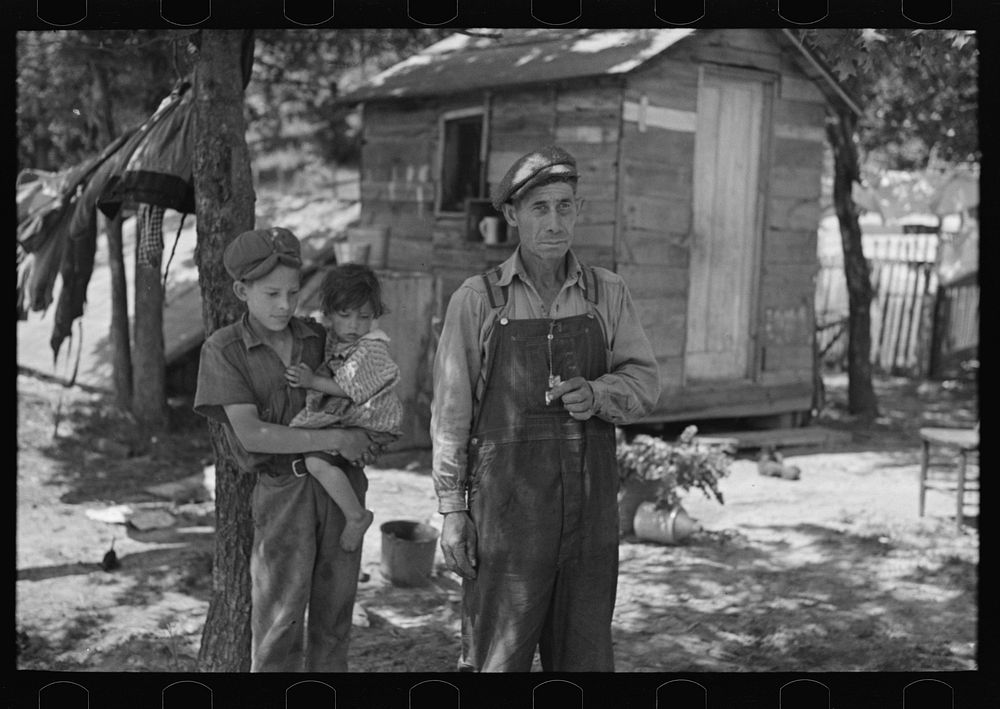 [Untitled photo, possibly related to: Alonzo Heath with two of his children. He is a farmer near Black River Falls…