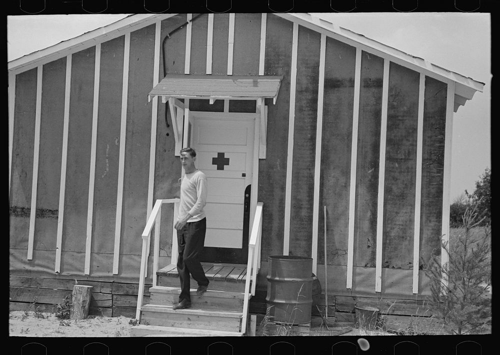 [Untitled photo, possibly related to: Resettlement workers in front of camp building, Black River Falls Land Use Project…
