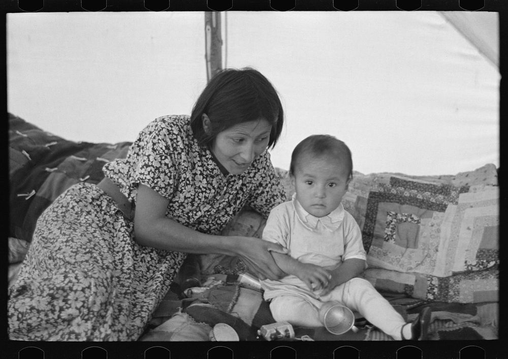 Indian mother and baby in their temporary home, near Little Fork, Minnesota by Russell Lee