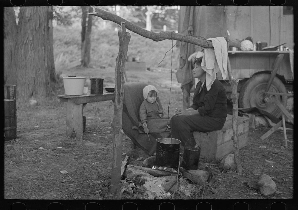 Indian mother and baby, blueberry pickers' camp near Little Fork, Minnesota by Russell Lee