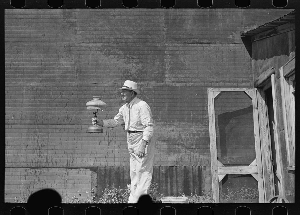 The auctioneer at S.W. Sparlin sale, Orth, Minnesota by Russell Lee