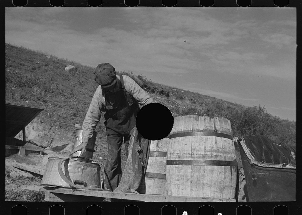 [Untitled photo, possibly related to: Filling barrels with spring water to be used on farm of Herman Gerling, Wheelock…