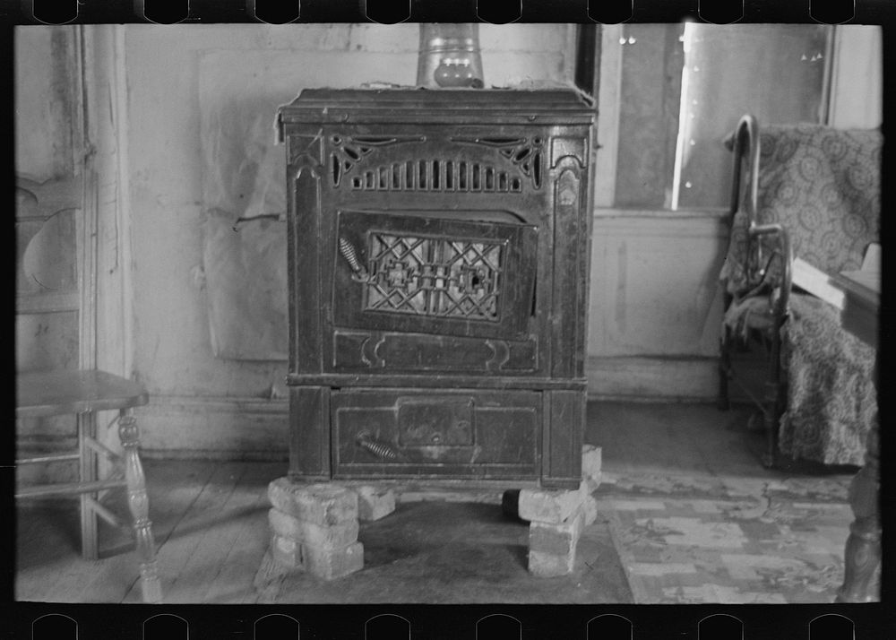 Heater in home of William Huravitch, farmer near Wheelock, North Dakota by Russell Lee