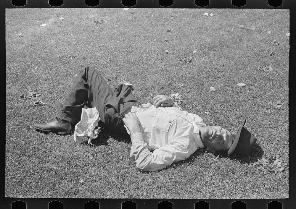 Transient laborer asleep in park, Gateway District, Minneapolis, Minnesota by Russell Lee