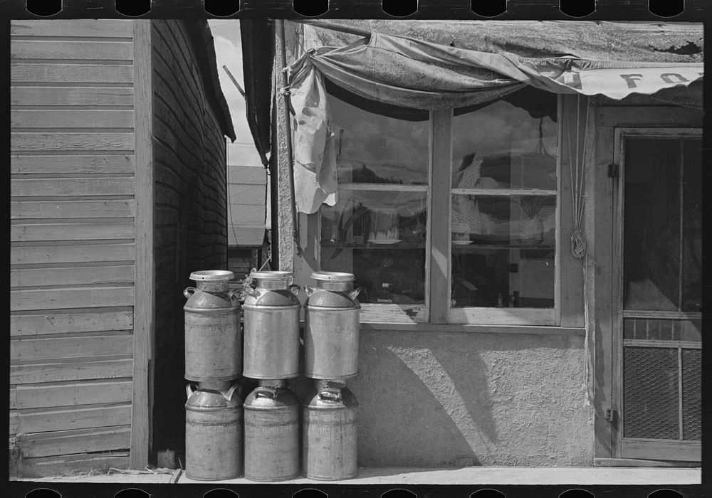 Milk cans and store, Cook, Minnesota by Russell Lee