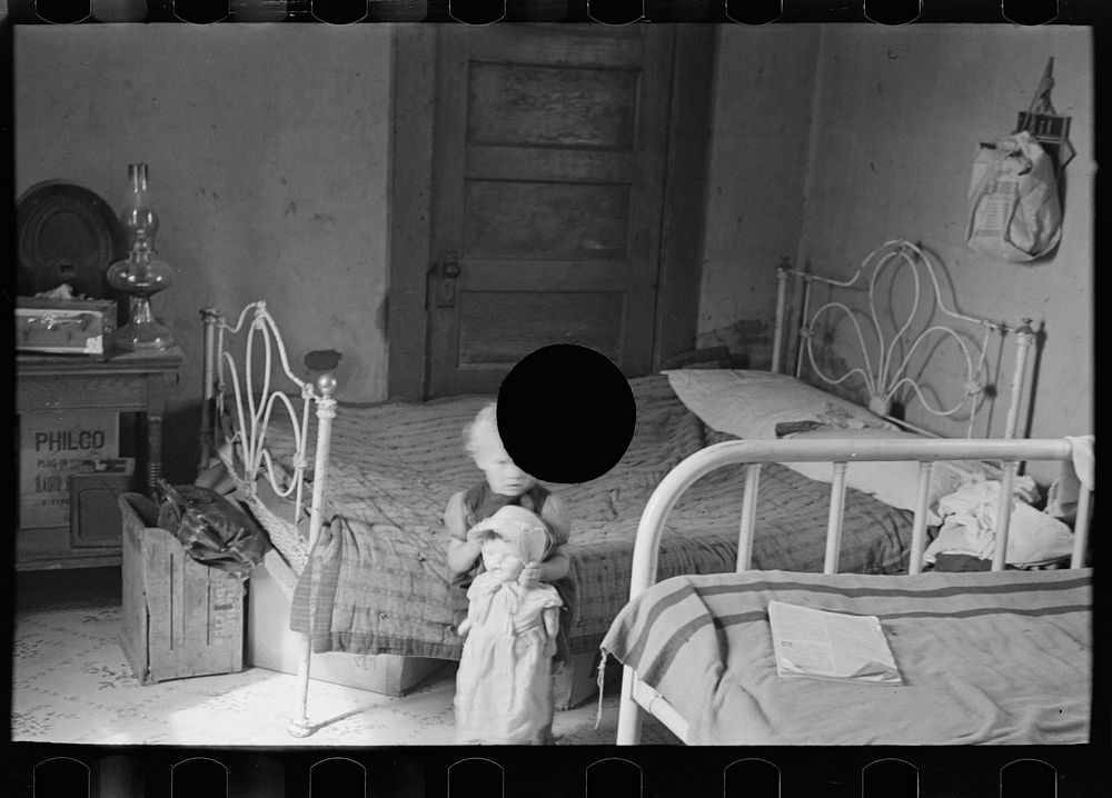 [Untitled photo, possibly related to: Child of Edwin Gorder in farmhouse bedroom, Williams County, North Dakota] by Russell…