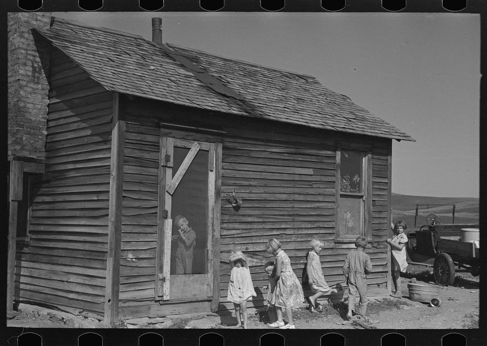 Children in front of Olaf Fugelberg's farmhouse. Williams County, North Dakota by Russell Lee