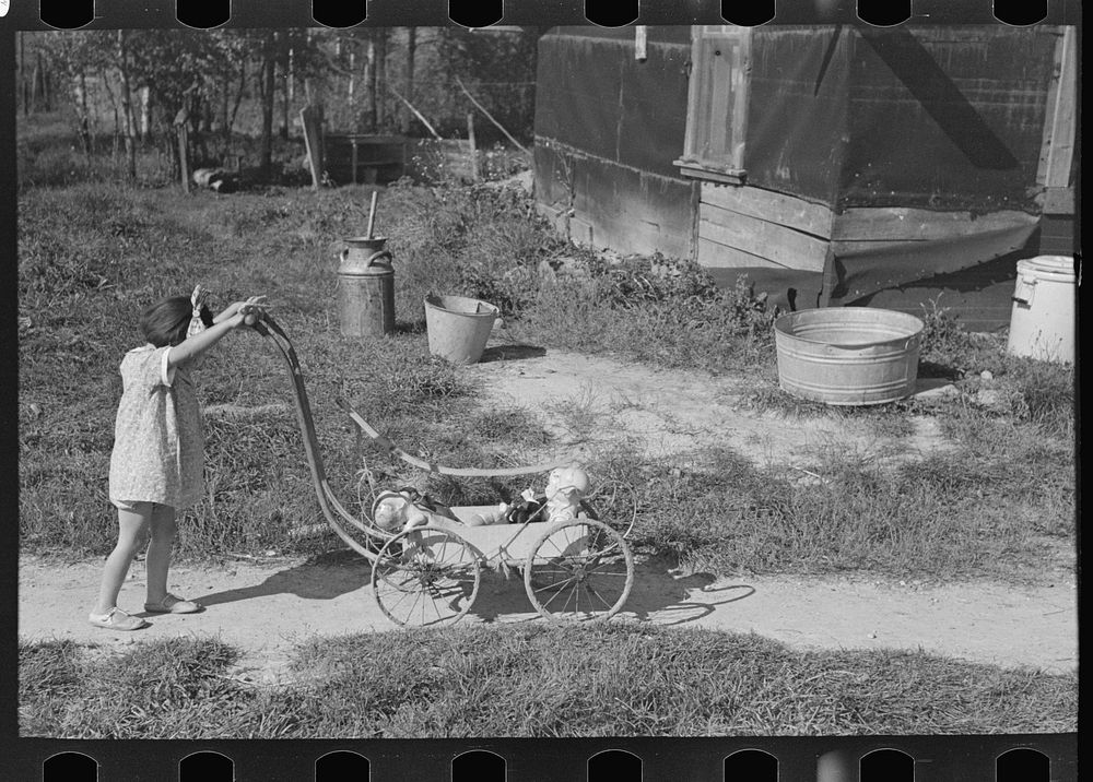 [Untitled photo, possibly related to: Doll buggy on farm near Northome, Minnesota] by Russell Lee