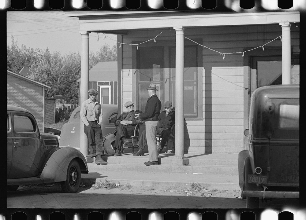 [Untitled photo, possibly related to: Men sitting in front of hotel in the early morning, Little Fork, Minnesota] by Russell…