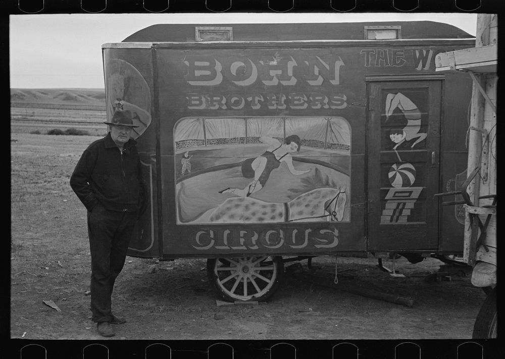 Maker of circus wagons with one of his wagons, Alger [i.e. Archer] Sheridan County, Montana by Russell Lee