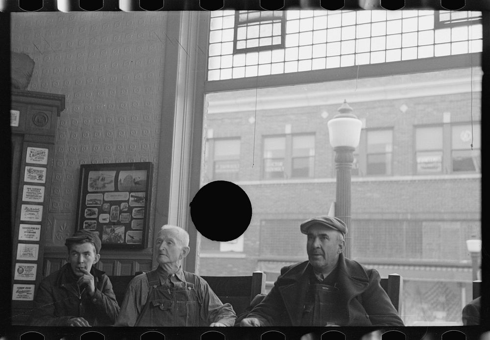 [Untitled photo, possibly related to: Men in the lobby of the Great Northern Hotel, Williston, North Dakota] by Russell Lee