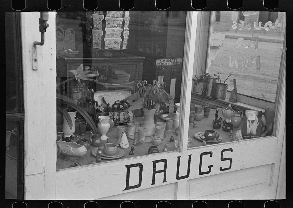 Drugstore window, Ray, North Dakota by Russell Lee