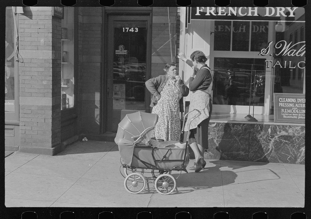 Women with baby carriage, L Street, Washington, D.C. by Russell Lee