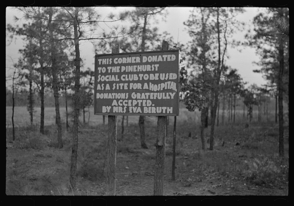 Sign showing donation of land by land developing project, central New Jersey pine area by Russell Lee