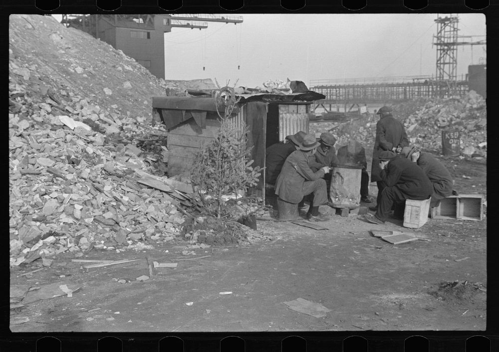 Unemployed workers in front of a shack with Christmas tree, East 12th Street, New York City by Russell Lee