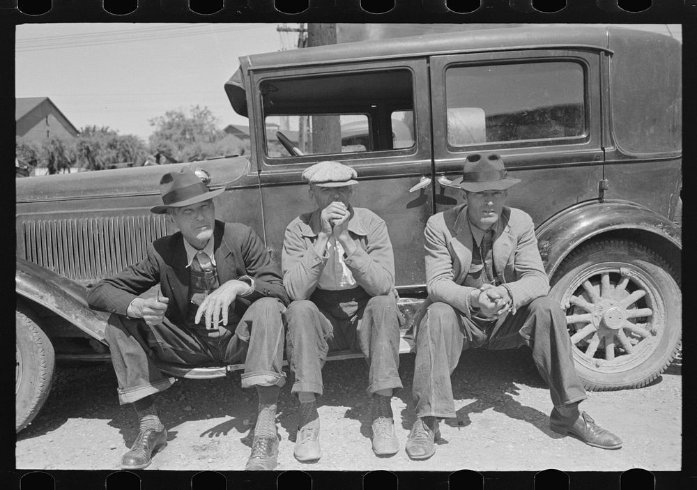 [Untitled photo, possibly related to: Farmers sitting on running board of car at liquid feed loading station, Owensboro…