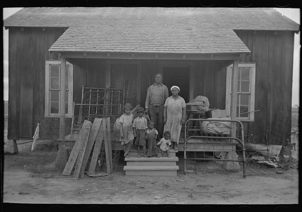 Southeast Missouri Farms. Family of FSA (Farm Security Administration) client on front porch of their old home, just before…