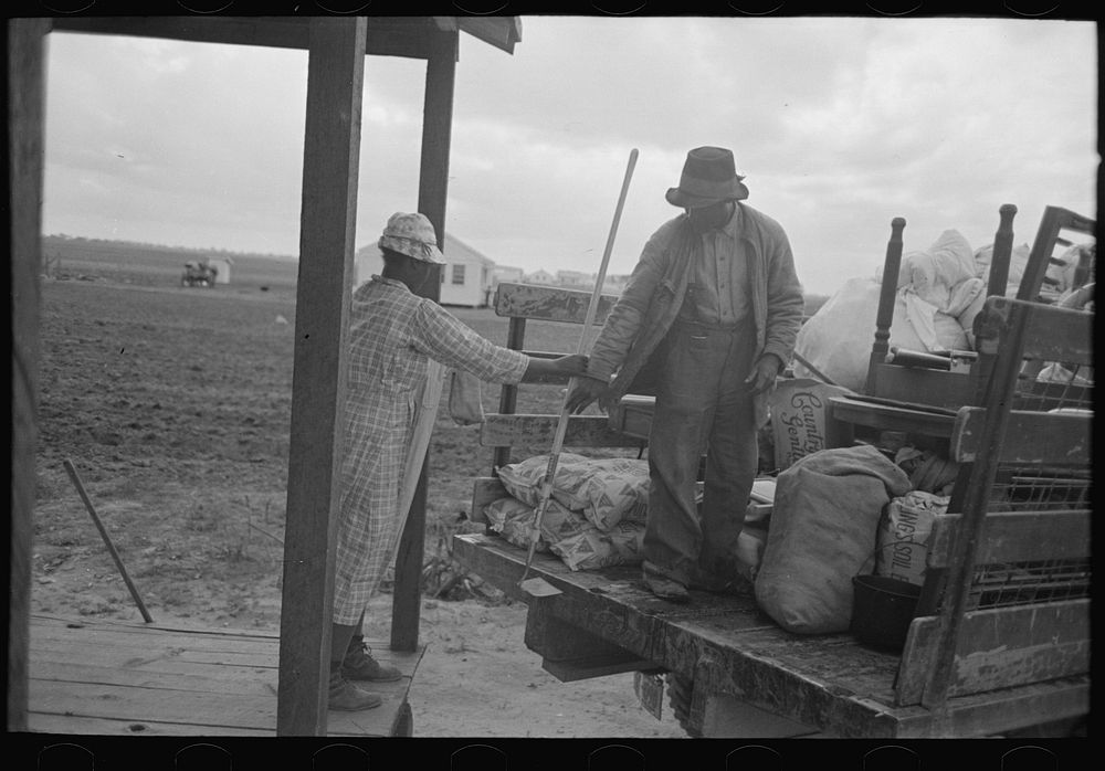 [Untitled photo, possibly related to: Southeast Missouri Farms. Loading truck in process of moving FSA (Farm Security…