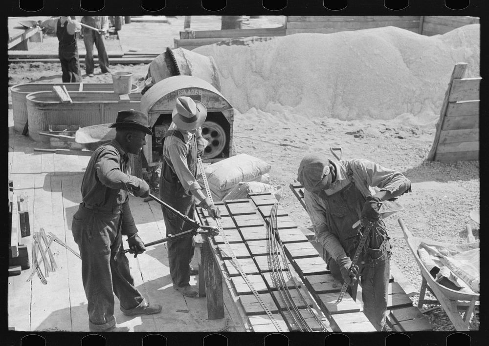 Pier plant. Placing perforated steel reinforcing strips in pier forms. They will project top and bottom. Southeast Missouri…