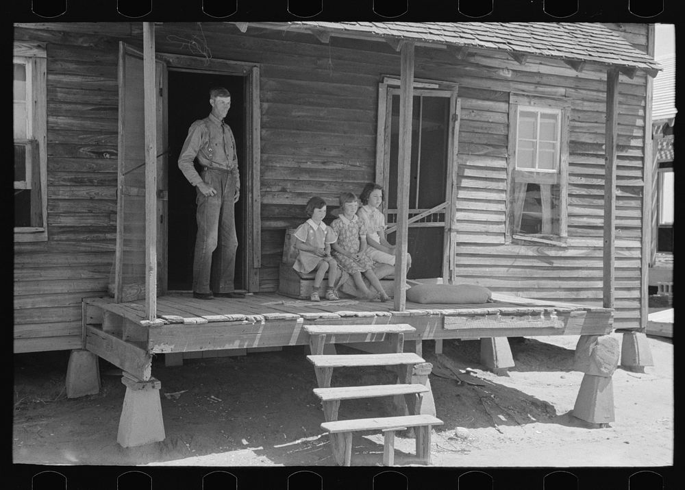 [Untitled photo, possibly related to: Front porch of sharecropper cabin, Southeast Missouri Farms] by Russell Lee
