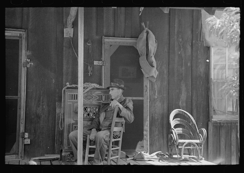 [Untitled photo, possibly related to: Front porch of sharecropper cabin, Southeast Missouri Farms] by Russell Lee