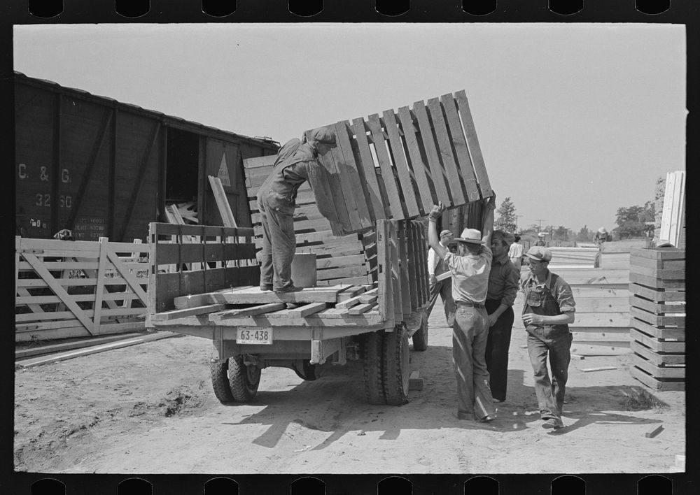 [Untitled photo, possibly related to: Southeast Missouri Farms Project. Transportation; privies being loaded onto truck.…