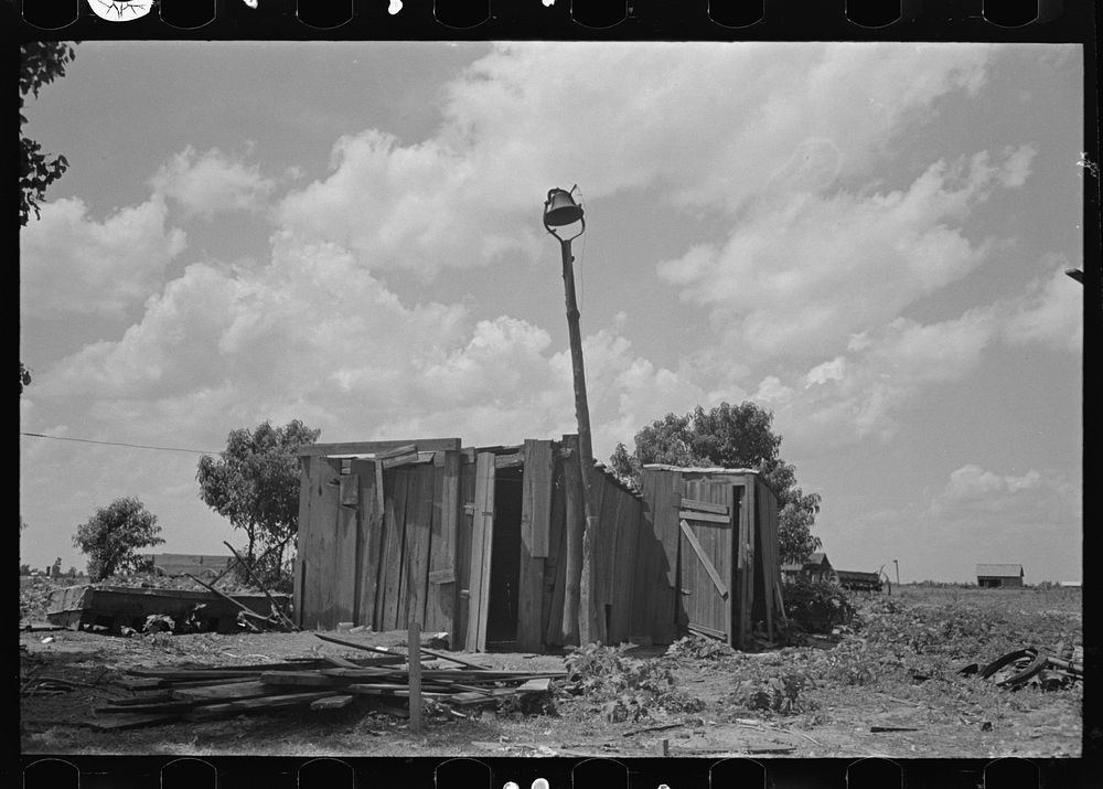 Shed of sharecropper with bell, Southeast Missouri Farms by Russell Lee