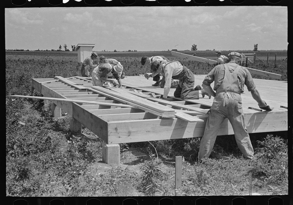 [Untitled photo, possibly related to: House erection. Laying subfloor. Southeast Missouri Farms Project] by Russell Lee