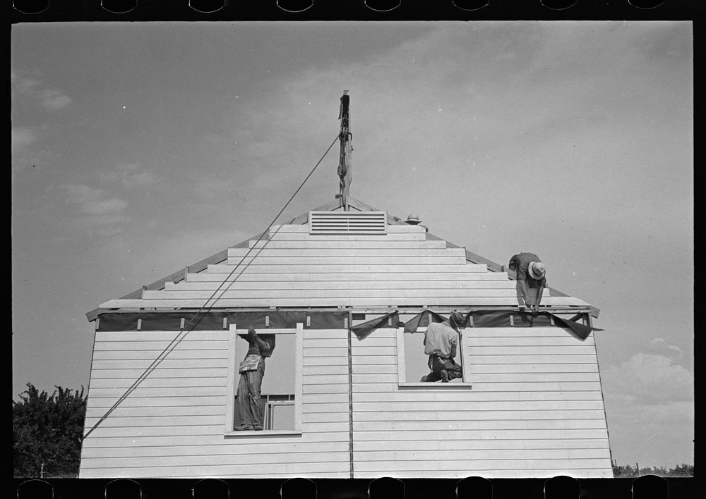 [Untitled photo, possibly related to: Southeast Missouri Farms. Erecting gable end on house] by Russell Lee