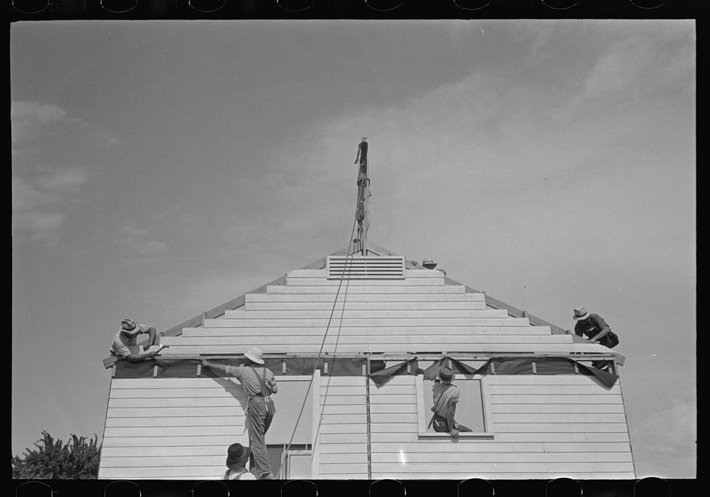 [Untitled photo, possibly related to: Southeast Missouri Farms. Erecting gable end on house] by Russell Lee