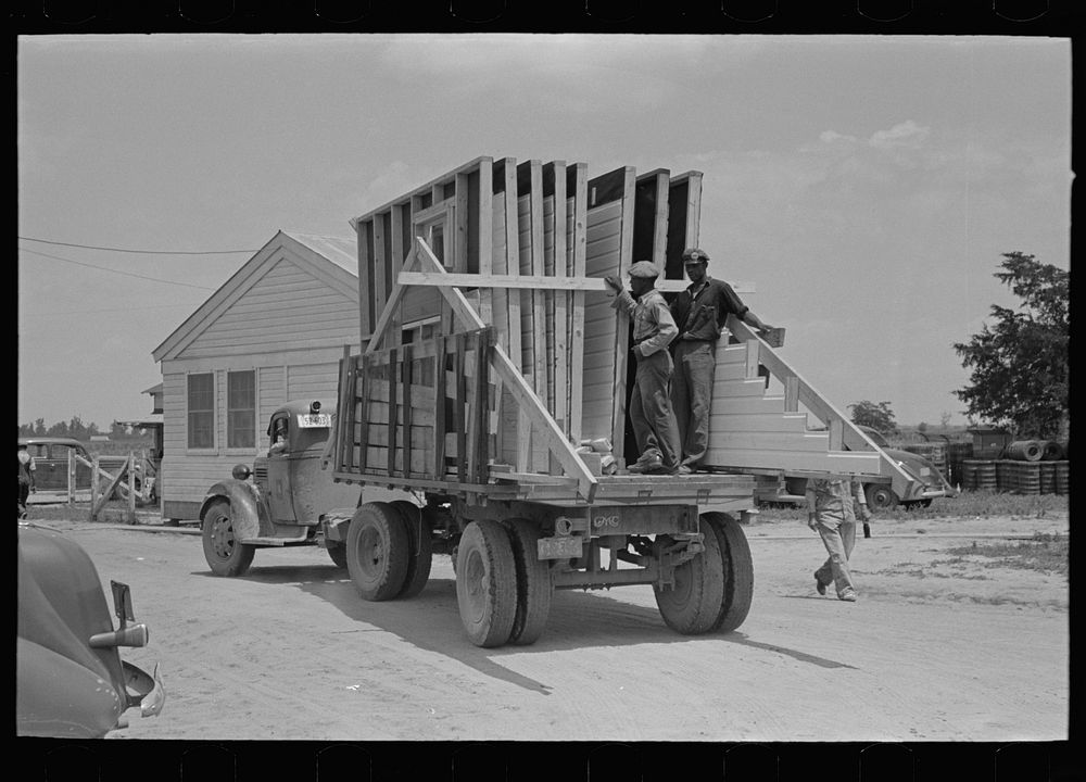 [Untitled photo, possibly related to: House erection. Delivery of materials. Completed standard load of shop assembled…