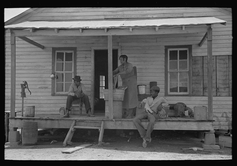 Rear porch of old cabin of FSA (Farm Security Administration) client, Southeast Missouri Farms by Russell Lee