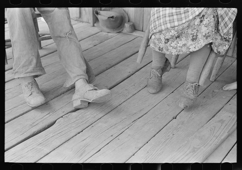 Detail of feet of sharecropper and his wife, Southeast Missouri Farms by Russell Lee