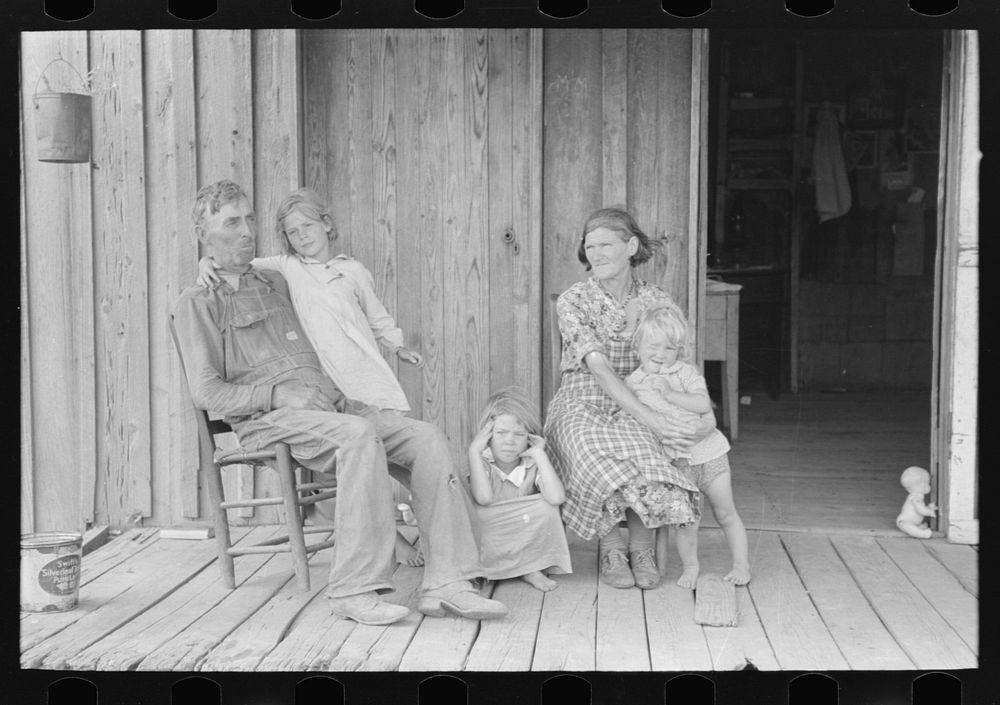 Grandparents with children on porch of sharecropper shack, Southeast Missouri Farms by Russell Lee