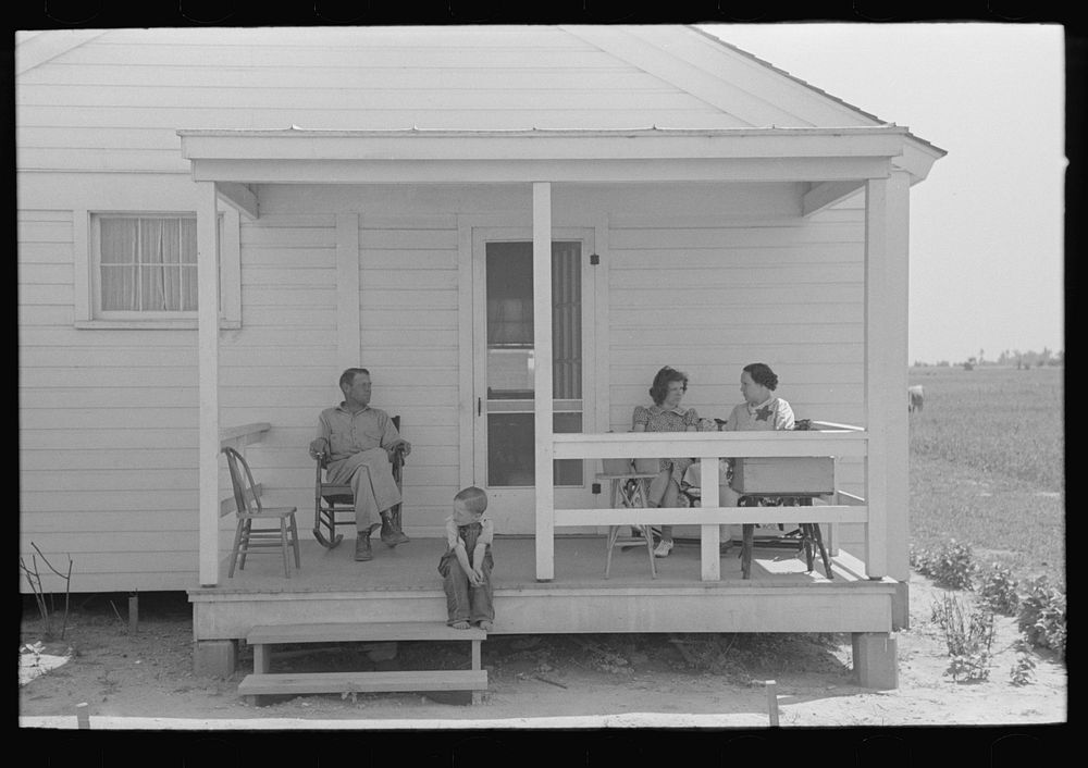 Southeast Missouri Farms. FSA (Farm Security Administration) clients on front porch of new home by Russell Lee