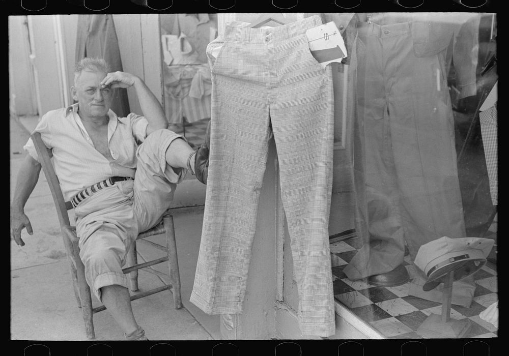 Storekeeper in front of men's store, Caruthersville, Missouri by Russell Lee