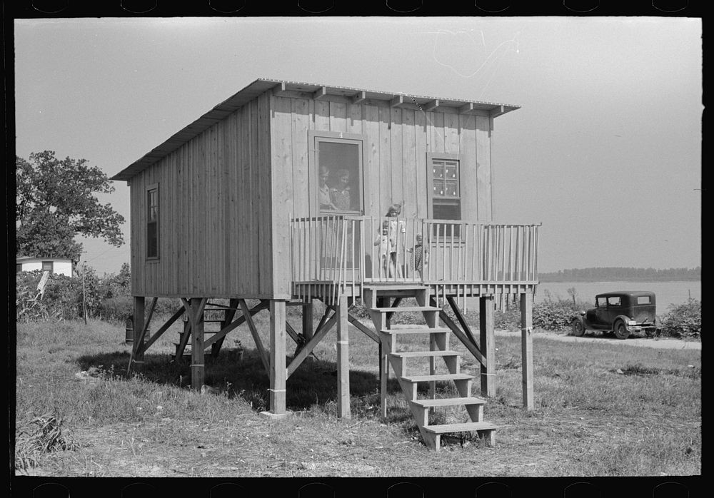 Type of house recently constructed on river side of levee, Caruthersville, Missouri by Russell Lee