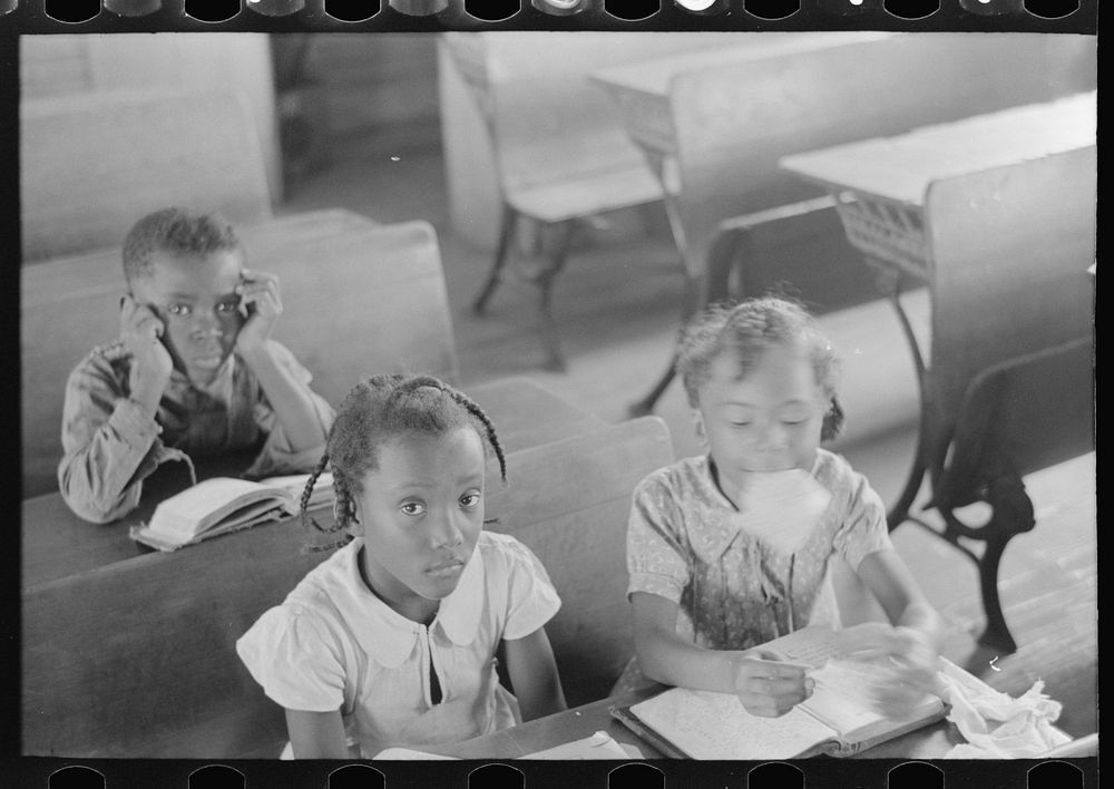 [Untitled photo, possibly related to: Schoolteacher explaining passage to pupil, La Forge, Missouri. School attended by…