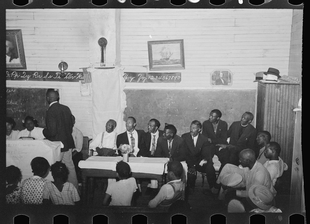[Untitled photo, possibly related to: Group of es at revival meeting, La Forge, Missouri] by Russell Lee