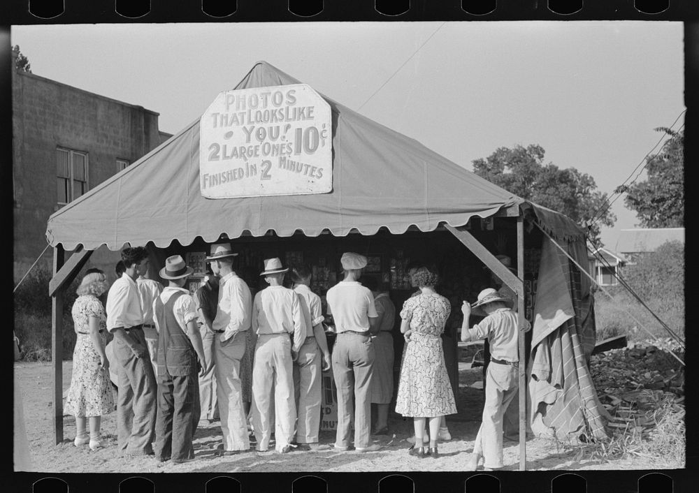 Steele, Missouri. A crowd in front of an itinerant photographer's tent by Russell Lee