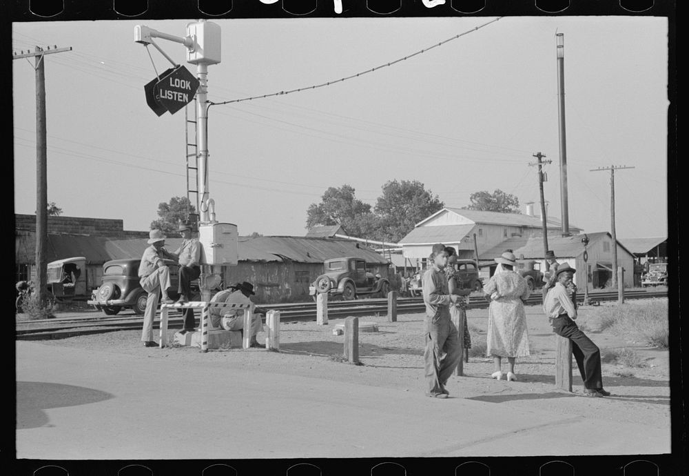[Untitled photo, possibly related to: Street scene, Steele, Missouri. Note cotton pickers bag in middle ground] by Russell…