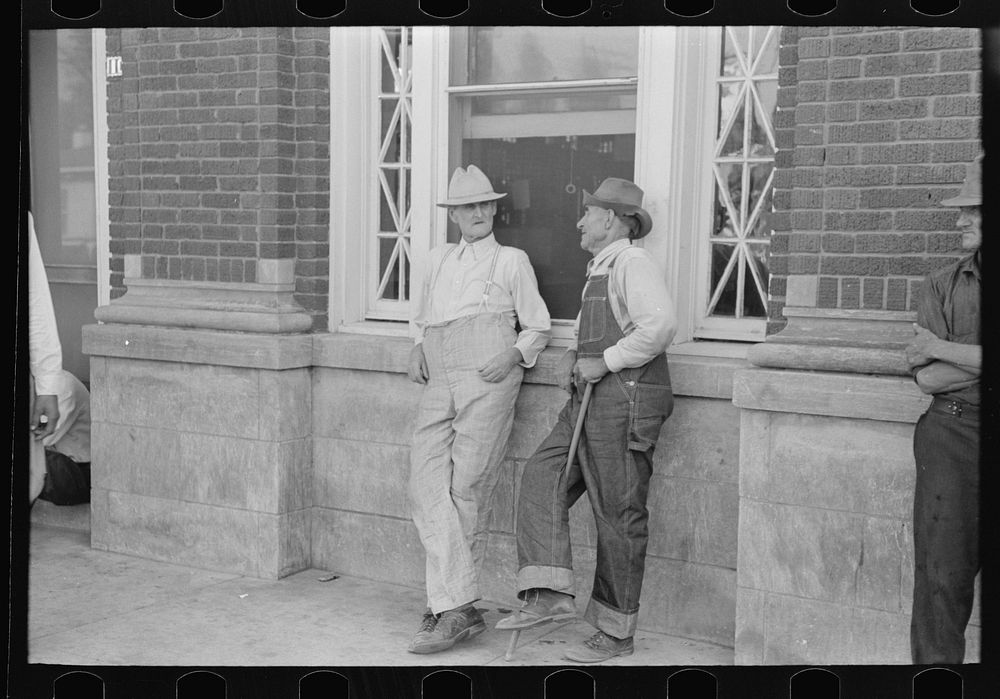 Farmers in front of bank building, Steele, Missouri by Russell Lee