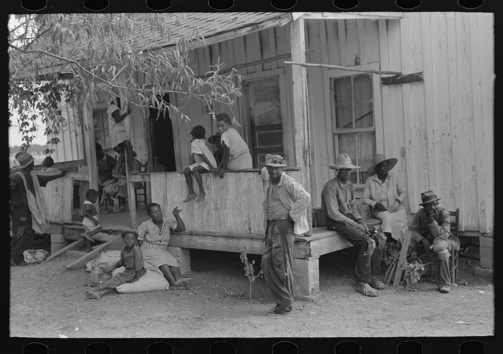 Group of  cotton pickers resting during lunch hour, Lehi, Arkansas by Russell Lee