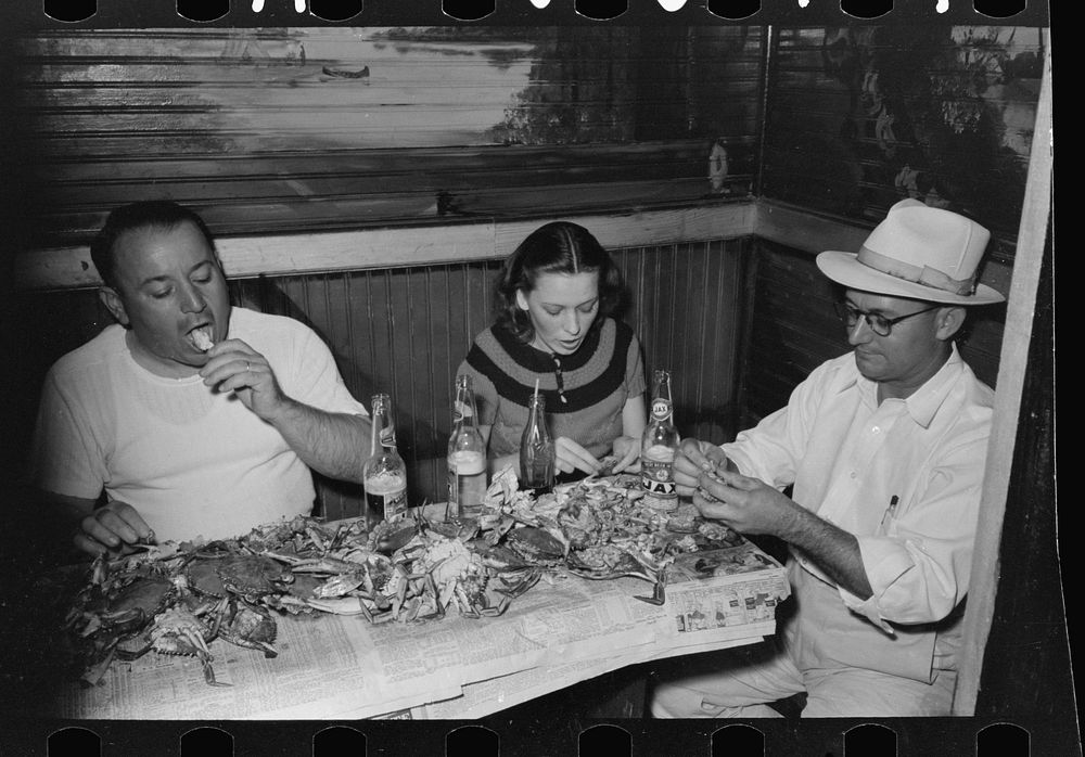 Residents of Raceland, Louisiana, eating crabs at crab boil by Russell Lee