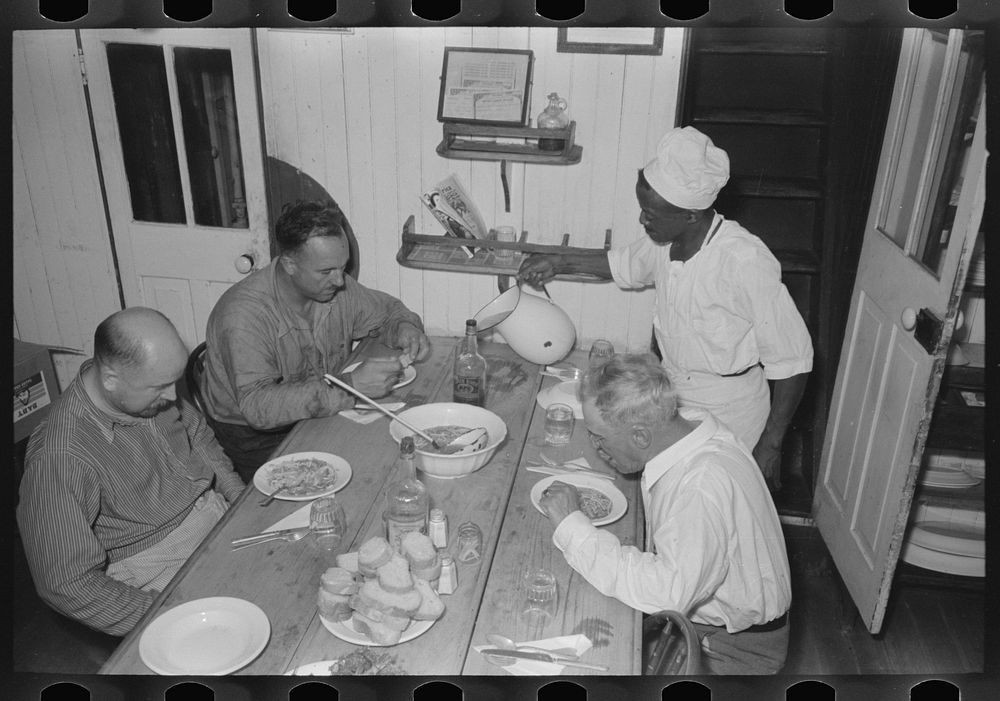 Dinner in the galley of the El Rito, packet boat, Louisiana by Russell Lee