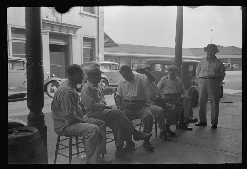 Group of Italians talking, Decatur Street, New Orleans, Louisiana by Russell Lee