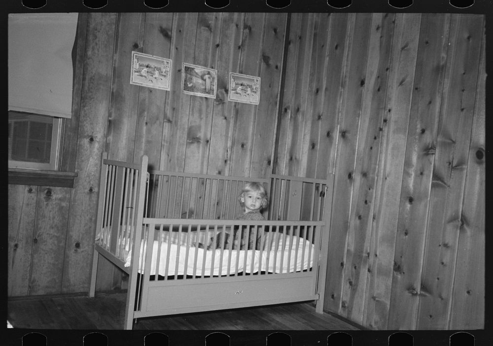 [Untitled photo, possibly related to: Child in bed in farm home, Lake Dick Project, Arkansas] by Russell Lee
