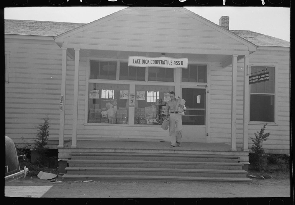 Farmer coming out of general store, Lake Dick Project, Arkansas by Russell Lee