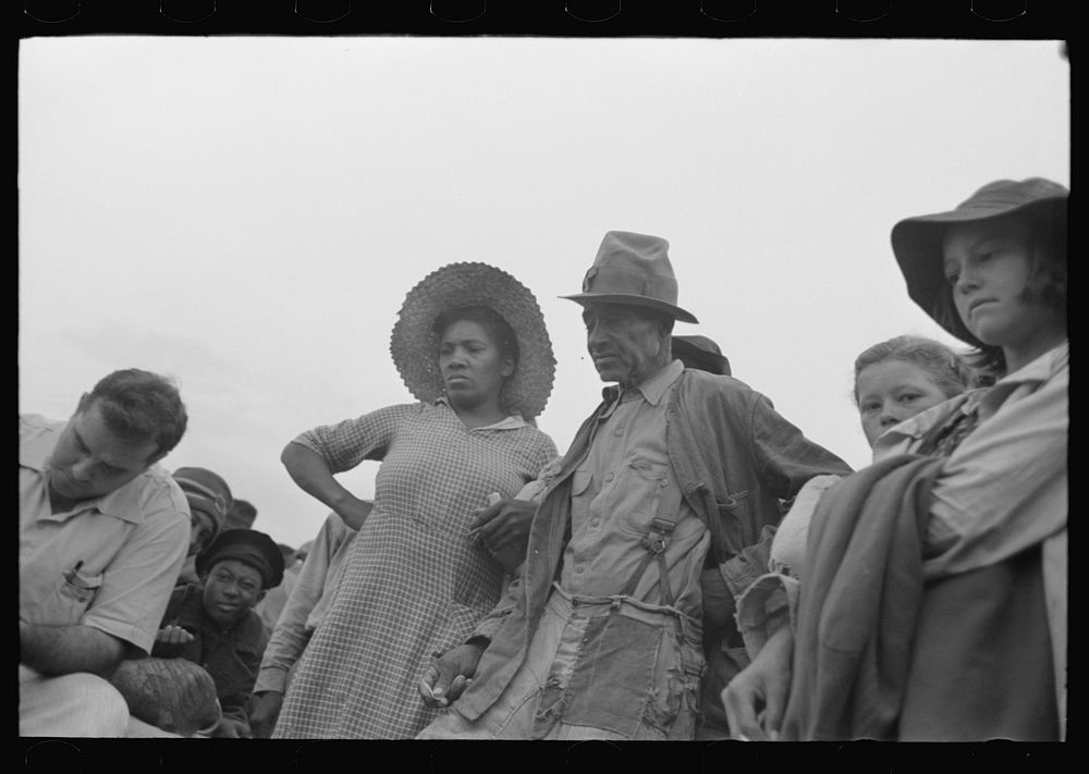 [Untitled photo, possibly related to: Cotton pickers being paid off, Lake Dick Project, Arkansas] by Russell Lee
